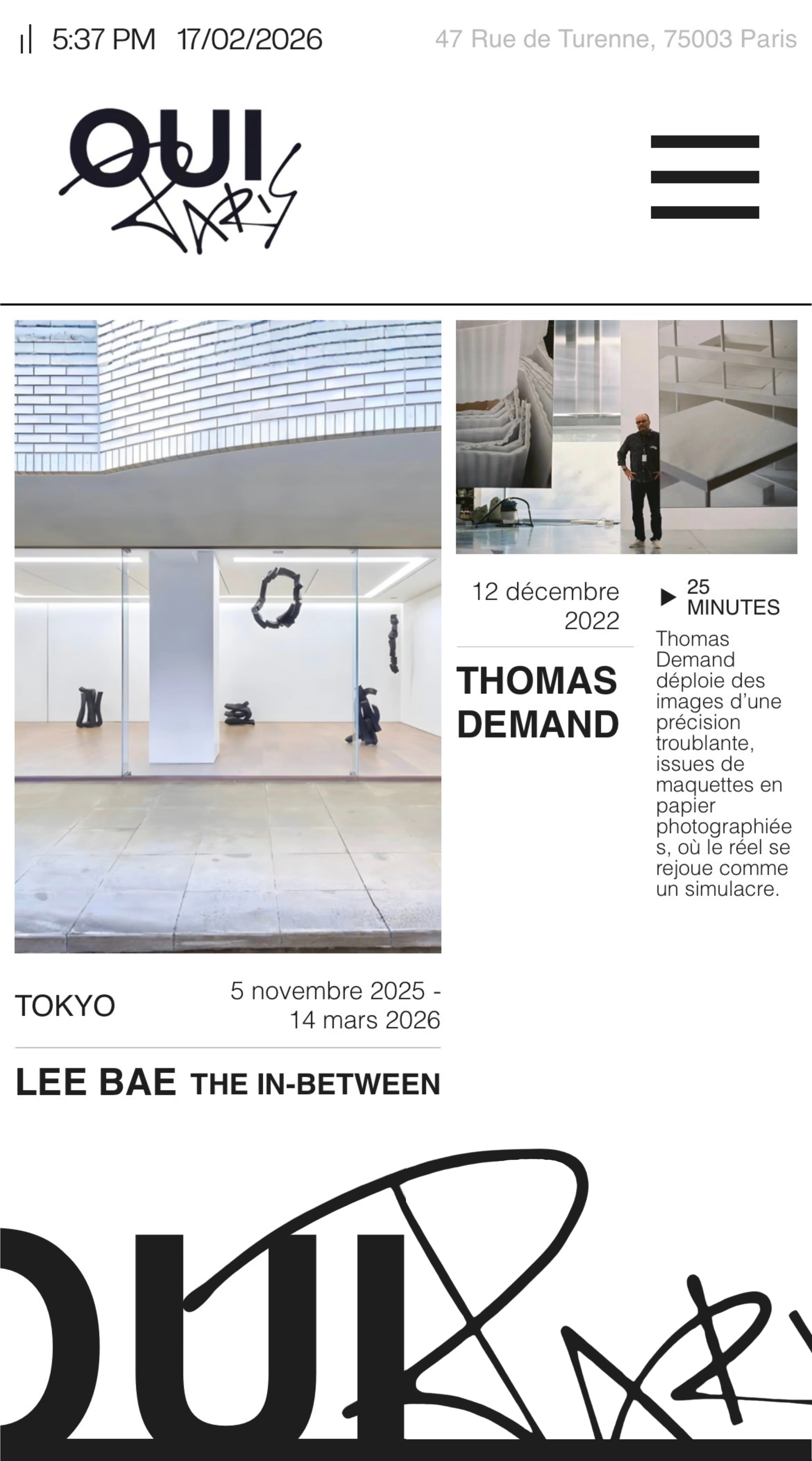 Gallery display space with abstract black sculptures on light wooden floor and white walls, promotional content for artist Lee Bae exhibition in Tokyo from November 2025 to March 2026, and a smaller photo of Thomas Demand with a description of his 25-minute presentation dated December 2022.