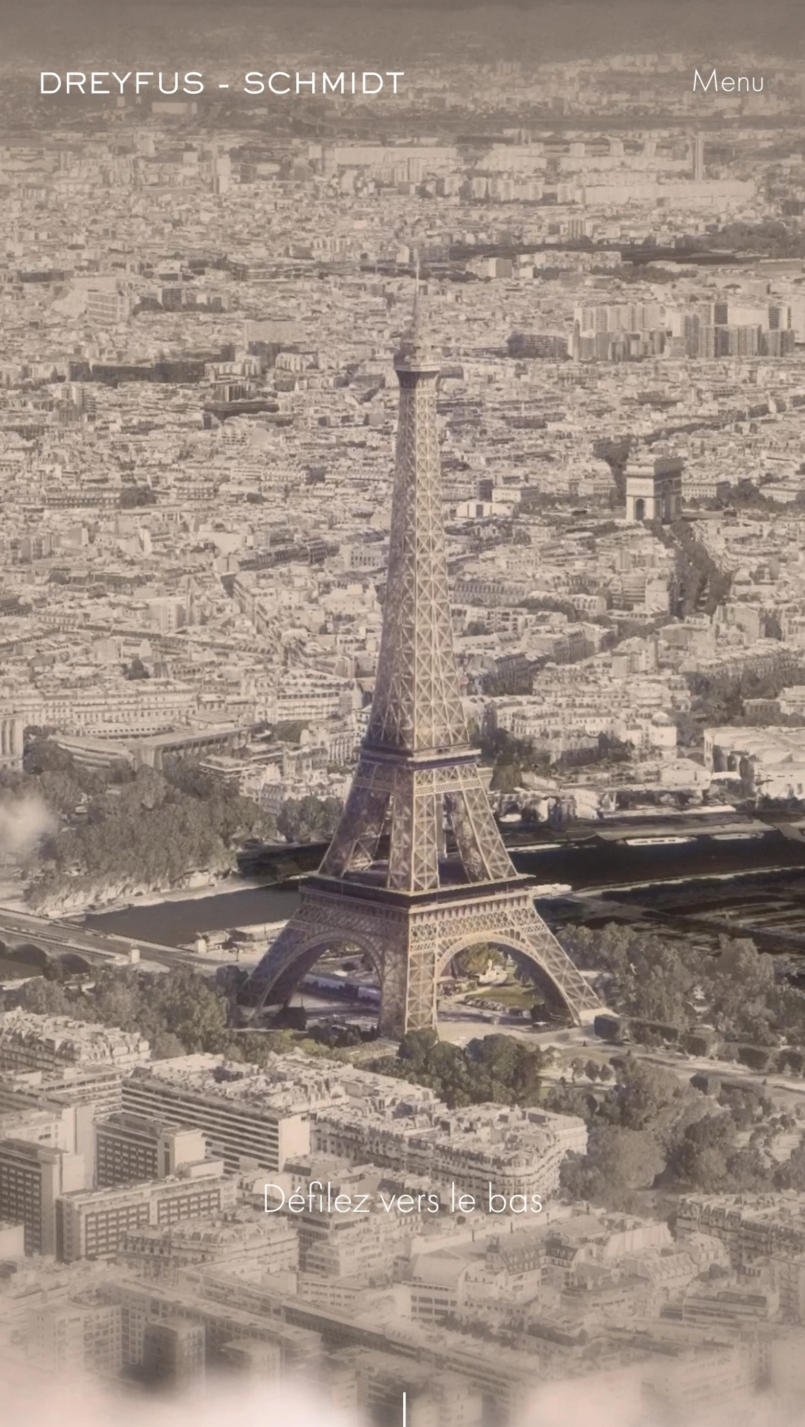 Aerial view of the Eiffel Tower surrounded by Paris cityscape with the Arc de Triomphe in the background.