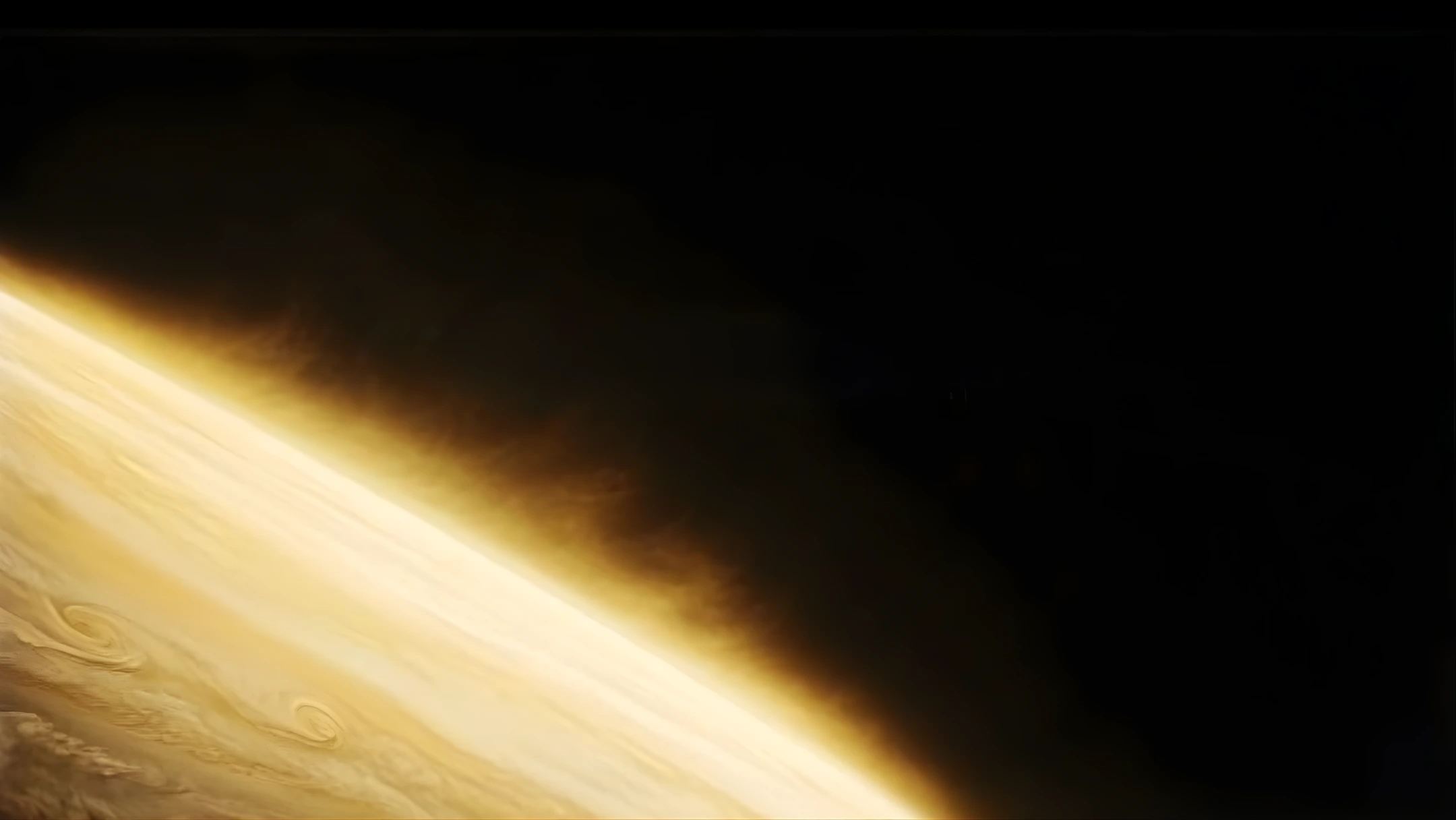 Close-up view of a golden-yellow planet with swirling cloud patterns against black space.